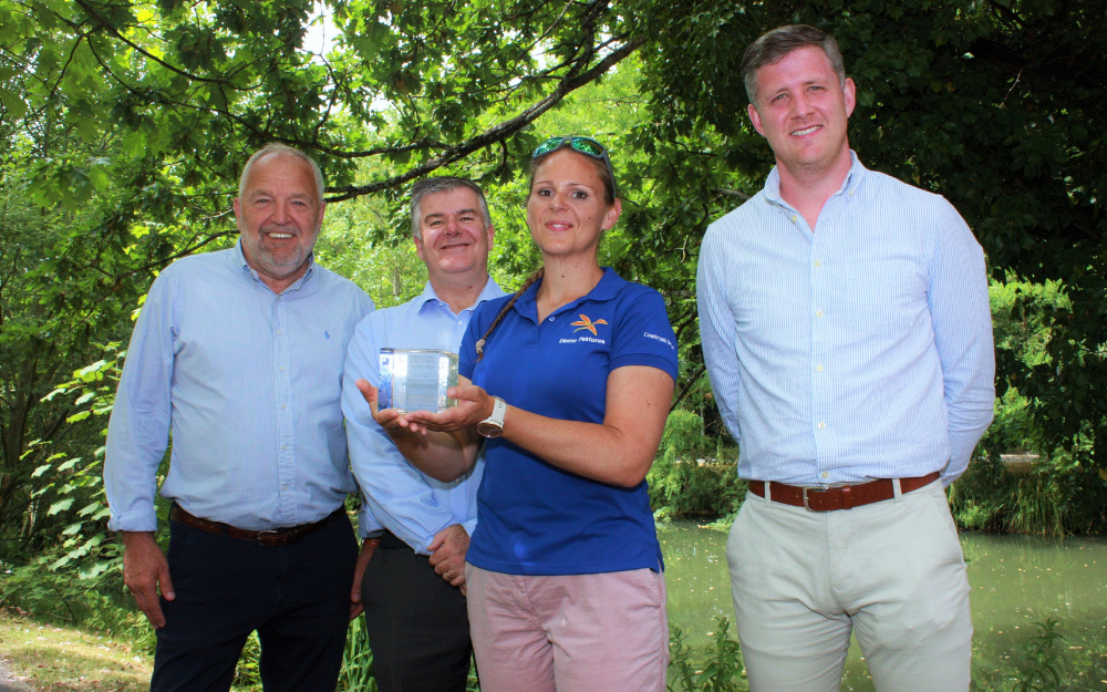 Four members of staff holding our Construction Excellence Award for client of the year