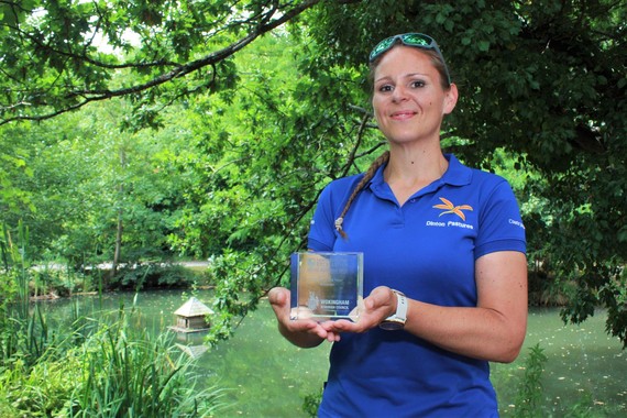 image of a WBC officer holding a glass Constructing Excellence Award