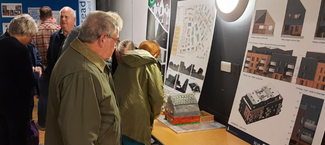 residents viewing detailed plans for the Gorse Ride regeneration at a public engagement event