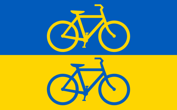 A Ukrainian flag with a graphic of a yellow bike on the blue stripe and a blue bike on the yellow stripe