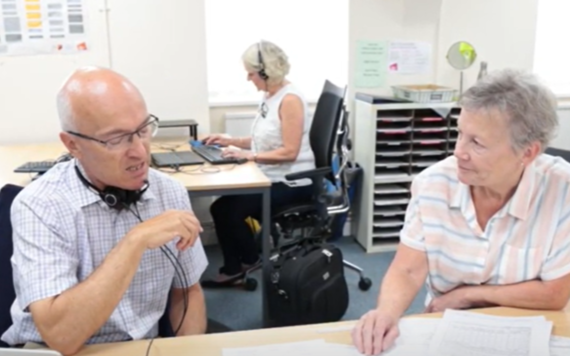 Two Citizens Advice Wokingham volunteers chat in the organisation's offices