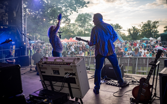 Musicians performing on stage at Wokingham Festival 