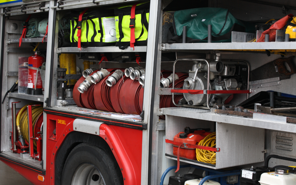 Equipment inside a fire engine as the doors are opened