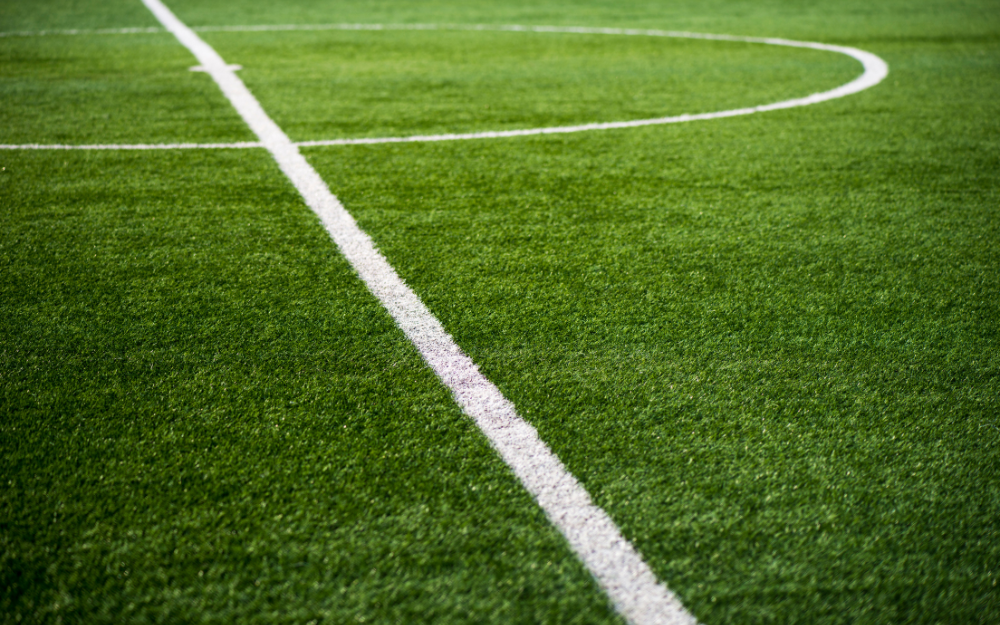 The half way line and centre circle on a football pitch