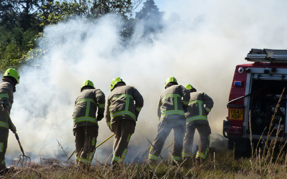 Firefighters tackling a wildfire on an extreme dry, hot day