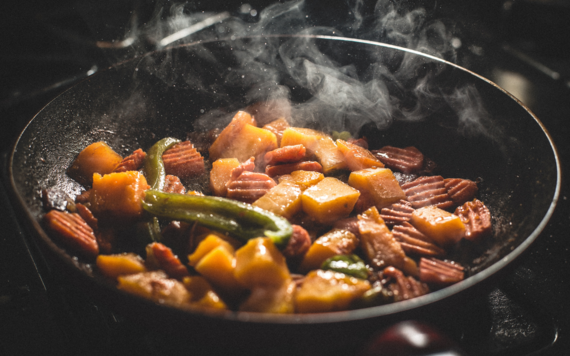 Some leftovers being cooked in a pan