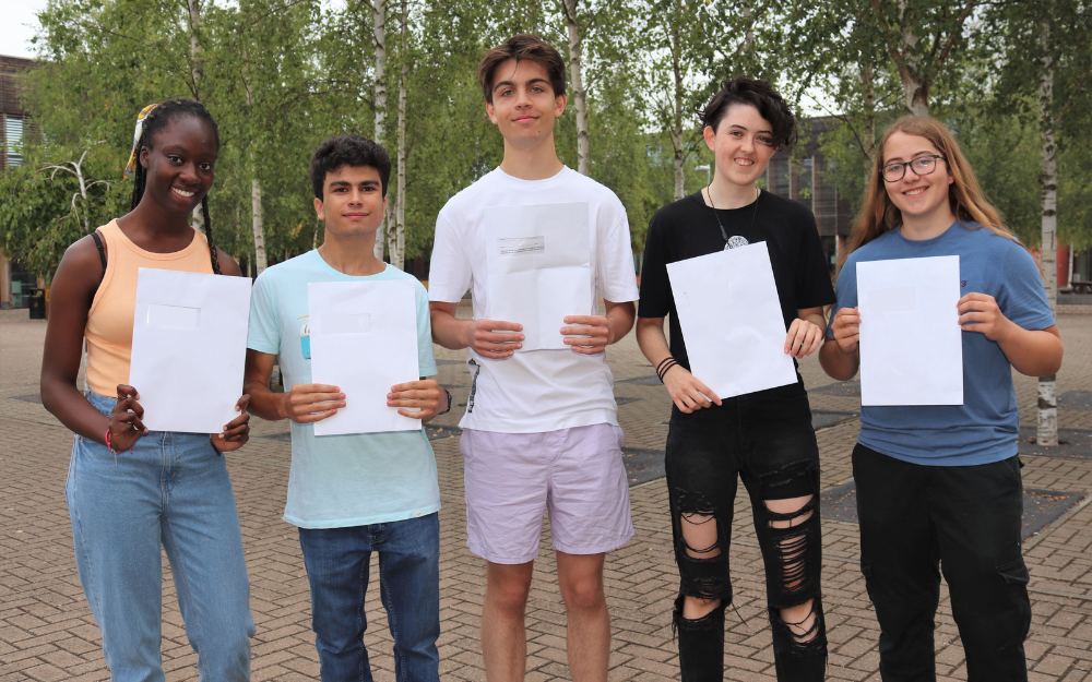 Happy students with their A Level results from Waingels College in Woodley