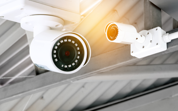 Two CCTV cameras on a ceiling