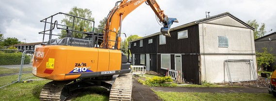 A house is demolished by a large machine at Gorse Ride in Finchampstead