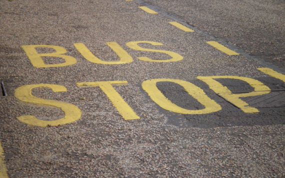 Close up of bus stop painted on road