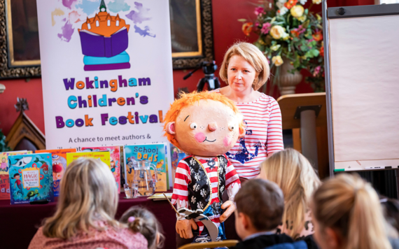 Author speaking with her puppet at Wokingham Children's Book Festival