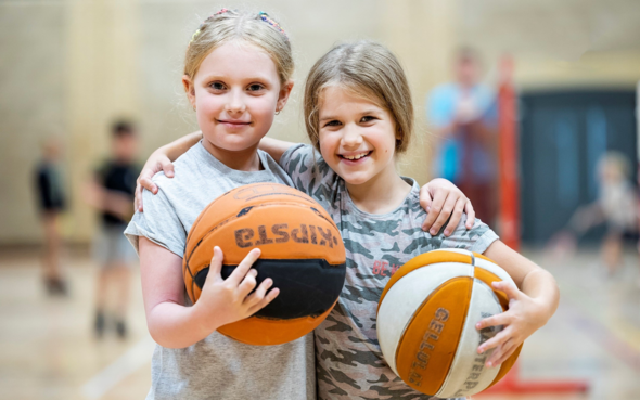 Two children with basketballs