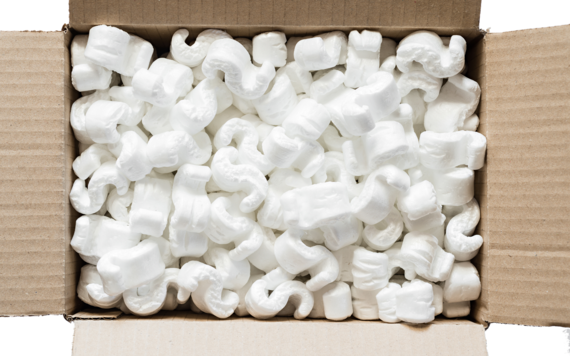 A top view of a box of small polystyrene pieces