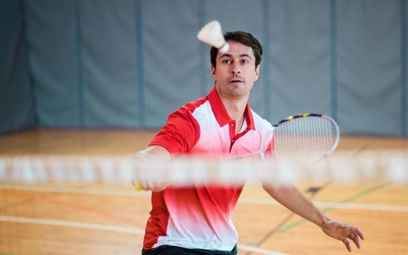 Man playing badminton