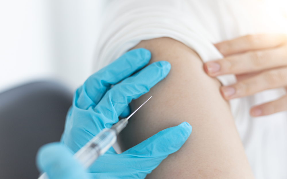 A vaccine being injected into someone's arm