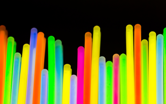 A line of glowsticks on a black background