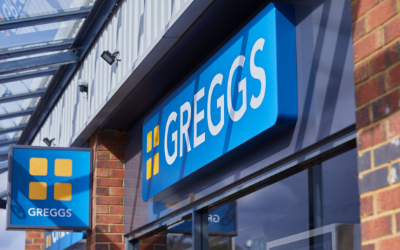 A Greggs sign on the front of a shop