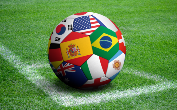 A football printed with images of different national flags on it