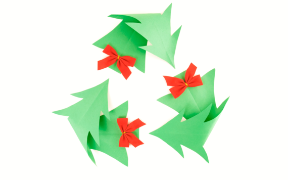 A recycling sign made of Christmas tree