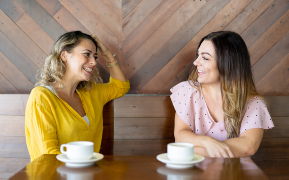 Two women chatting in a cafe