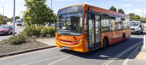 photo of an orange Thames Valley Buses bus outside on a sunny day