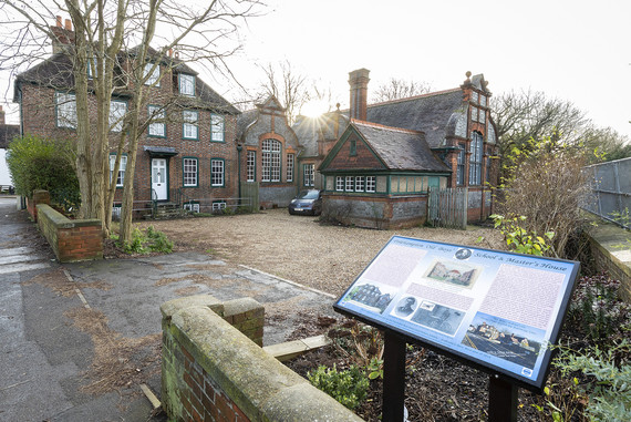 photograph of the Old Polehampton Boys' School in Twyford with the sun rising above the building line