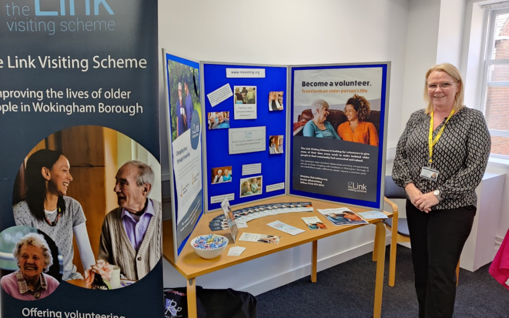 A link visiting scheme volunteer at their information stand at a volunteer recrutiment event