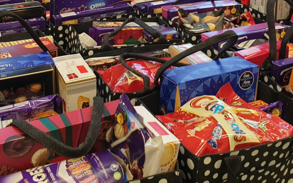 Photograph showing Christmas gift bags full of food and chocolates