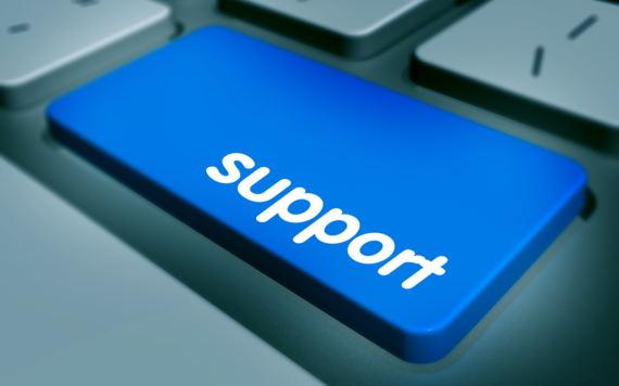 A blue button on keyboard with the word support