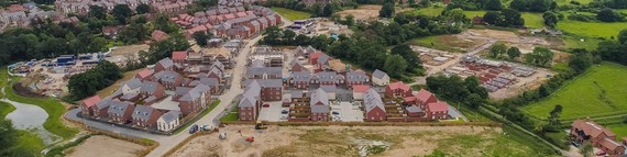 aerial view of a mostly completed housing site in the borough