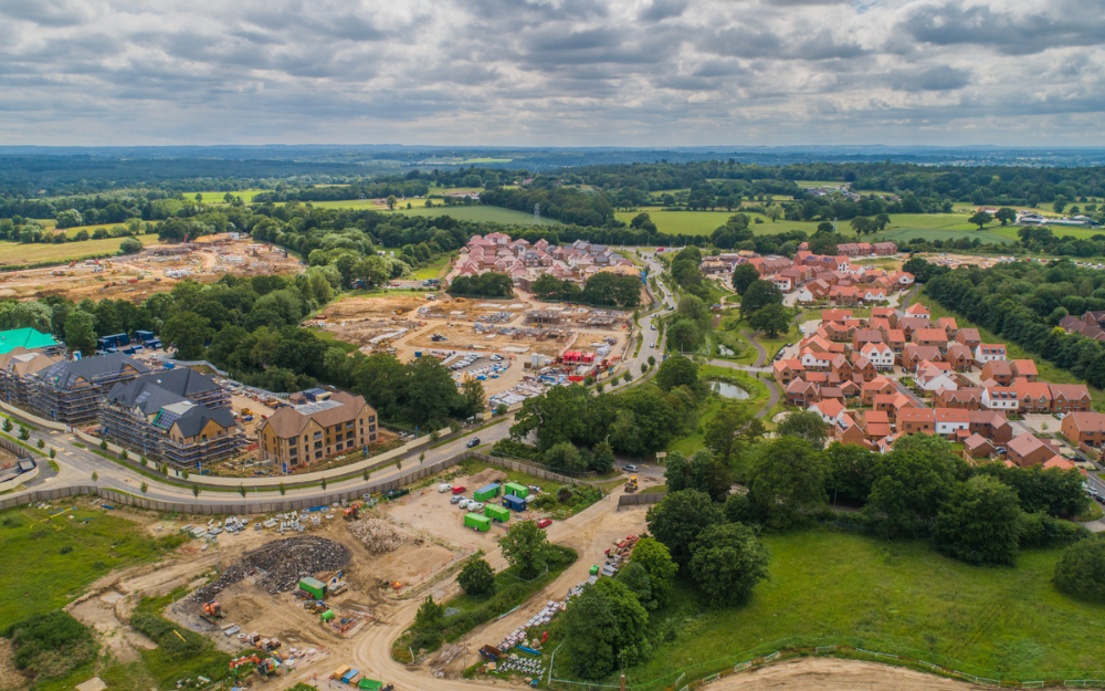 A new housing development and countryside at a new build area in Wokingham Borough