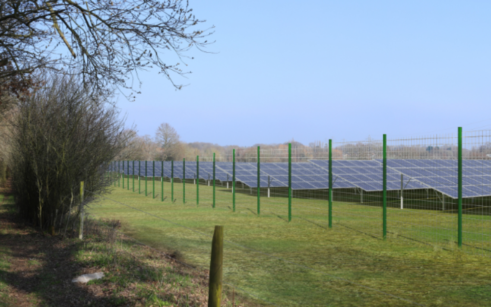 Artists impression of a new solar farm, with a gate in front of it, next to a country footpath
