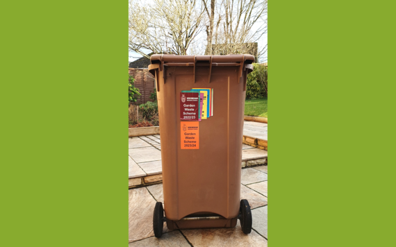 A brown garden waste bin 
