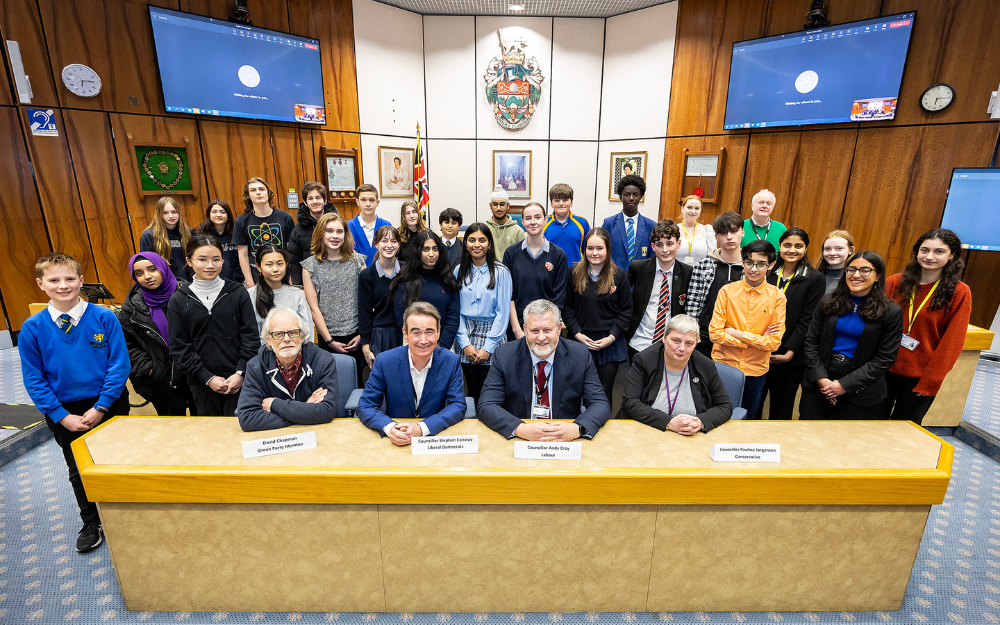 Councillors and children in the council chamber at our Shute End offices