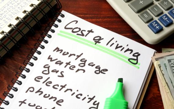 photo shows list of bills to pay under the title cost of living