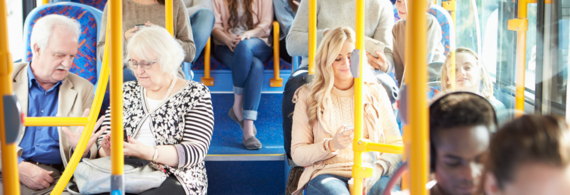 close-up of passengers sitting on a bus and chatting
