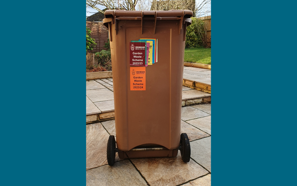 A garden waste bin with a 2023/24 orange sticker on it