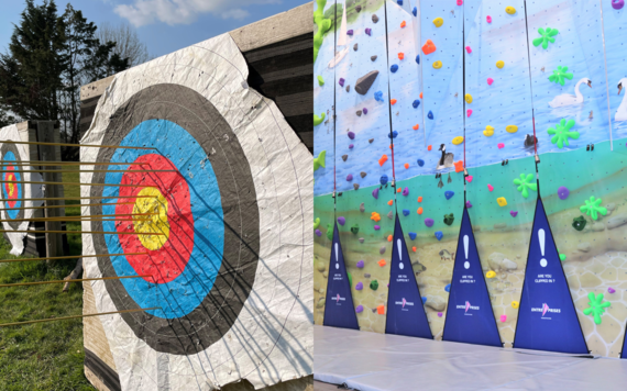 On the left is an archery target and on the right is the climbing wall inside Dinton Activity Centre