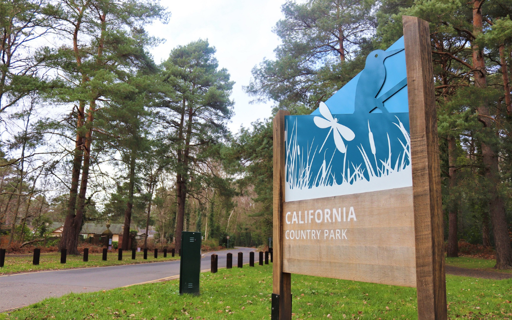 The entrance to a wooded area at California Country Park, including its signage