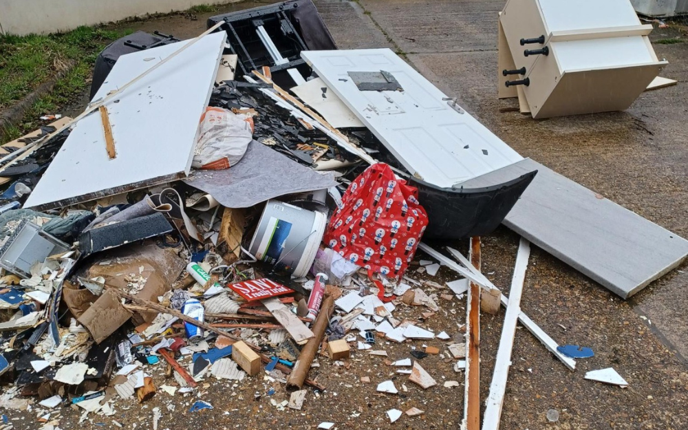 A pile of flytipping found in Finchampstead, including builders waste, wood and Christmas wrapping paper