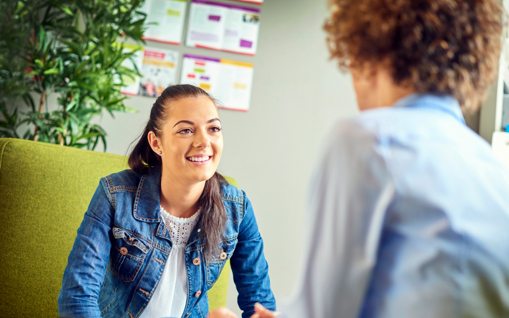 A coach works with a young person to help them into training or employment