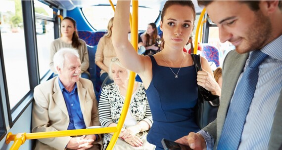 Interior of a bus with lots of passengers