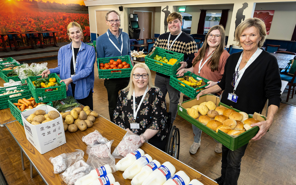 Volunteers at SHARE Arborfield with vegetables, milk, bread and other fresh produce
