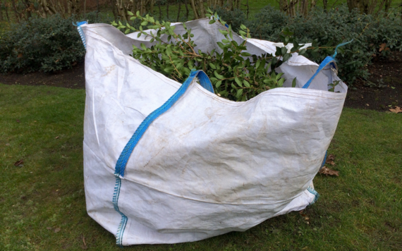 A bag of grass clipping, leaves and cutting