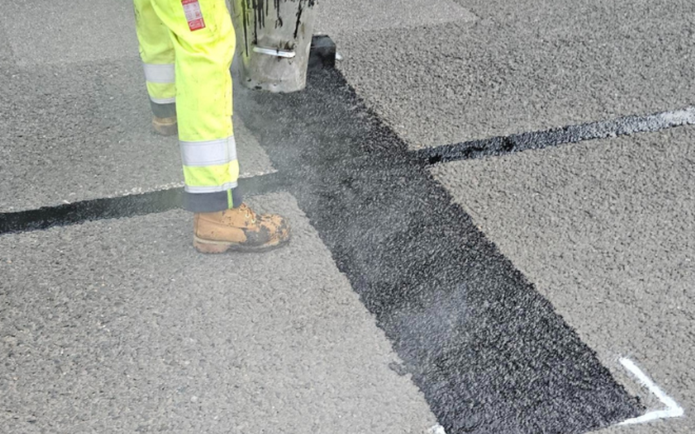 Asphalt preservation treatment being applied to a road