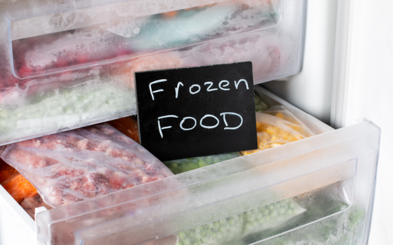 A close-up of the inside of a freezer. Text read frozen food