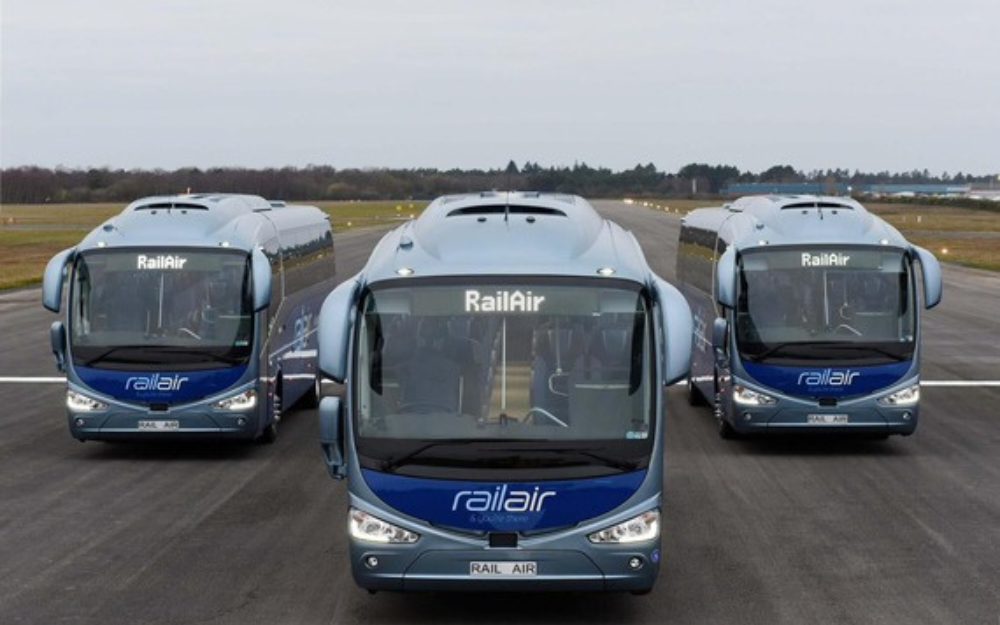 Three Rail Air coaches on a runway