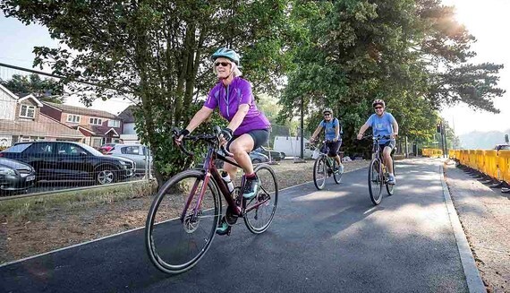 Three people cycling on a new cycleway