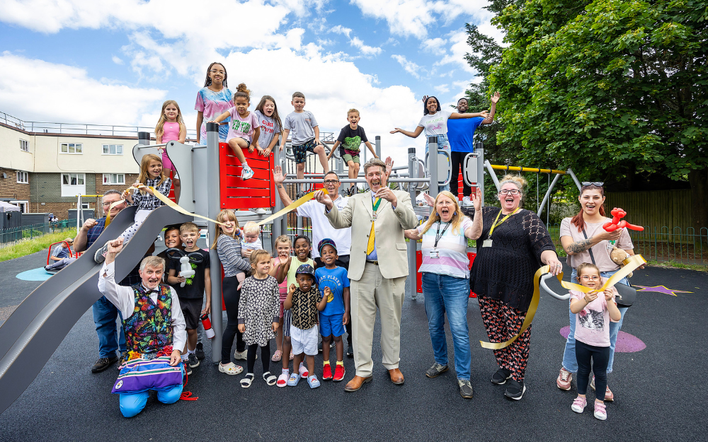 Deputy Mayor Cllr Adrian Mather with children and teams who worked on Clements Close playground project