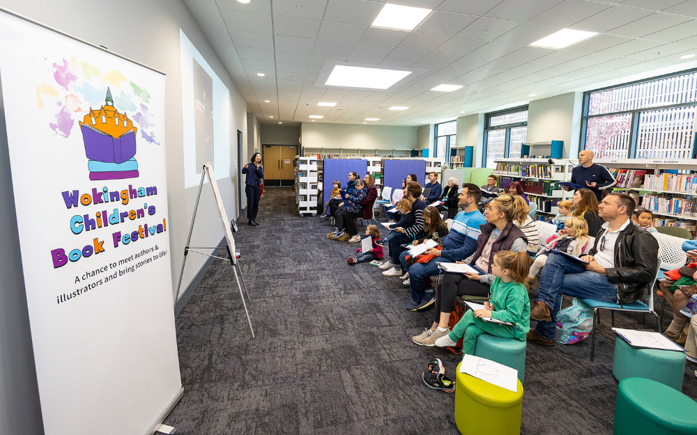 Dozens of families watch on during an author event at the 2022 Wokingham Book Festival